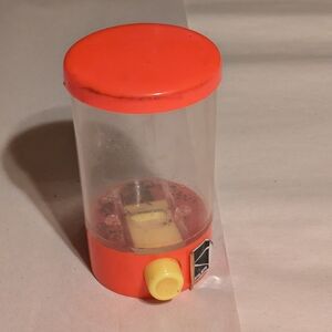 Orange and Yellow Capsule Toy Dispenser